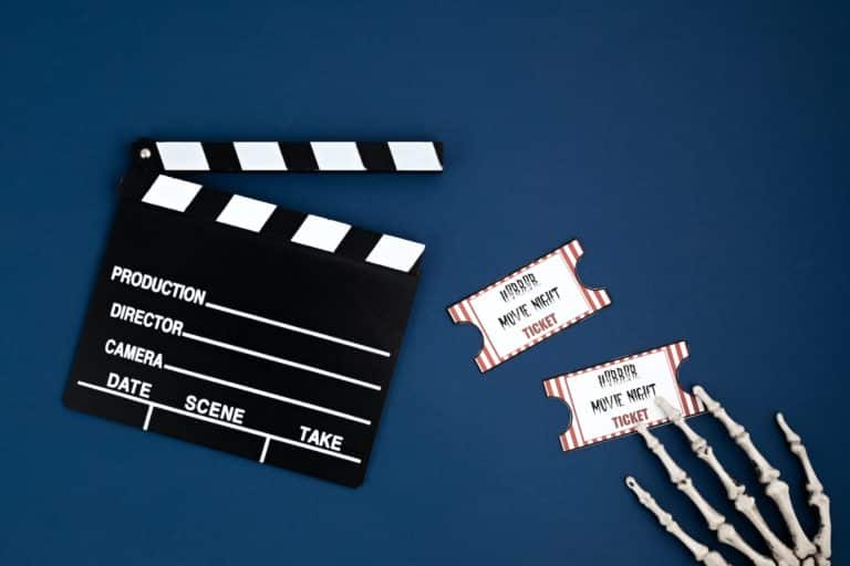 Movie clapperboard and halloween decoration. Horror movie night, halloween party invitation